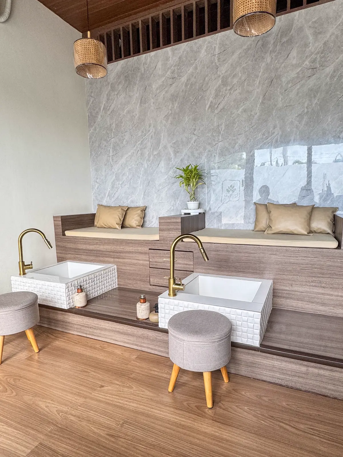 Foot spa lounge with gold faucets