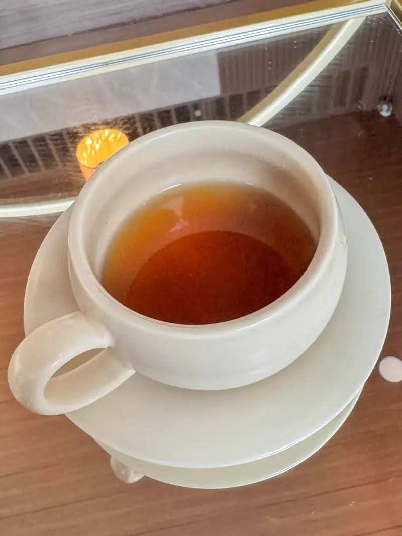 A cup of warm tea served after a session